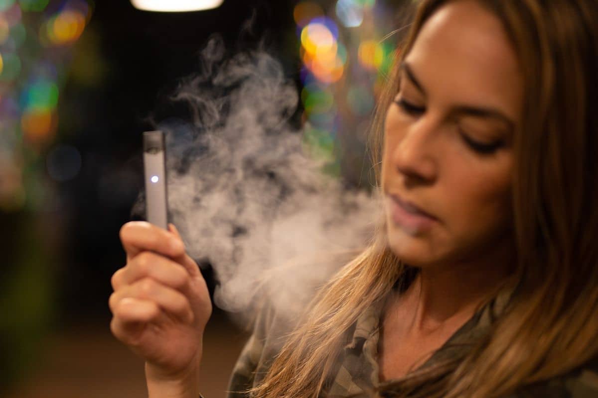A girl smoking cake disposable vape