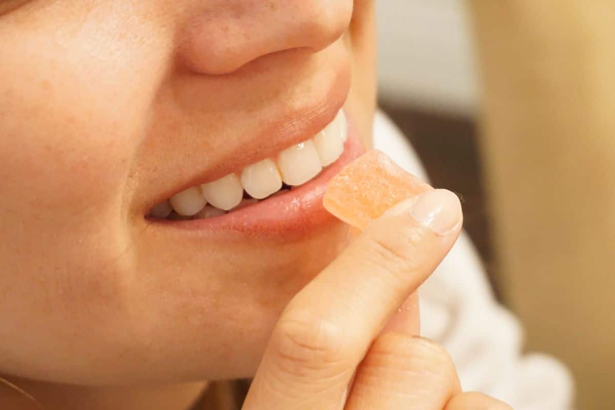 Woman having delta 8 THC gummies