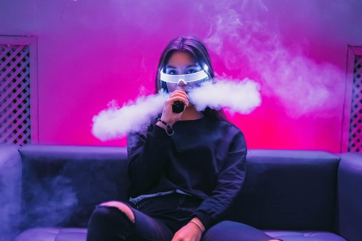 A lady vaping in a pub A lady vaping in a pub