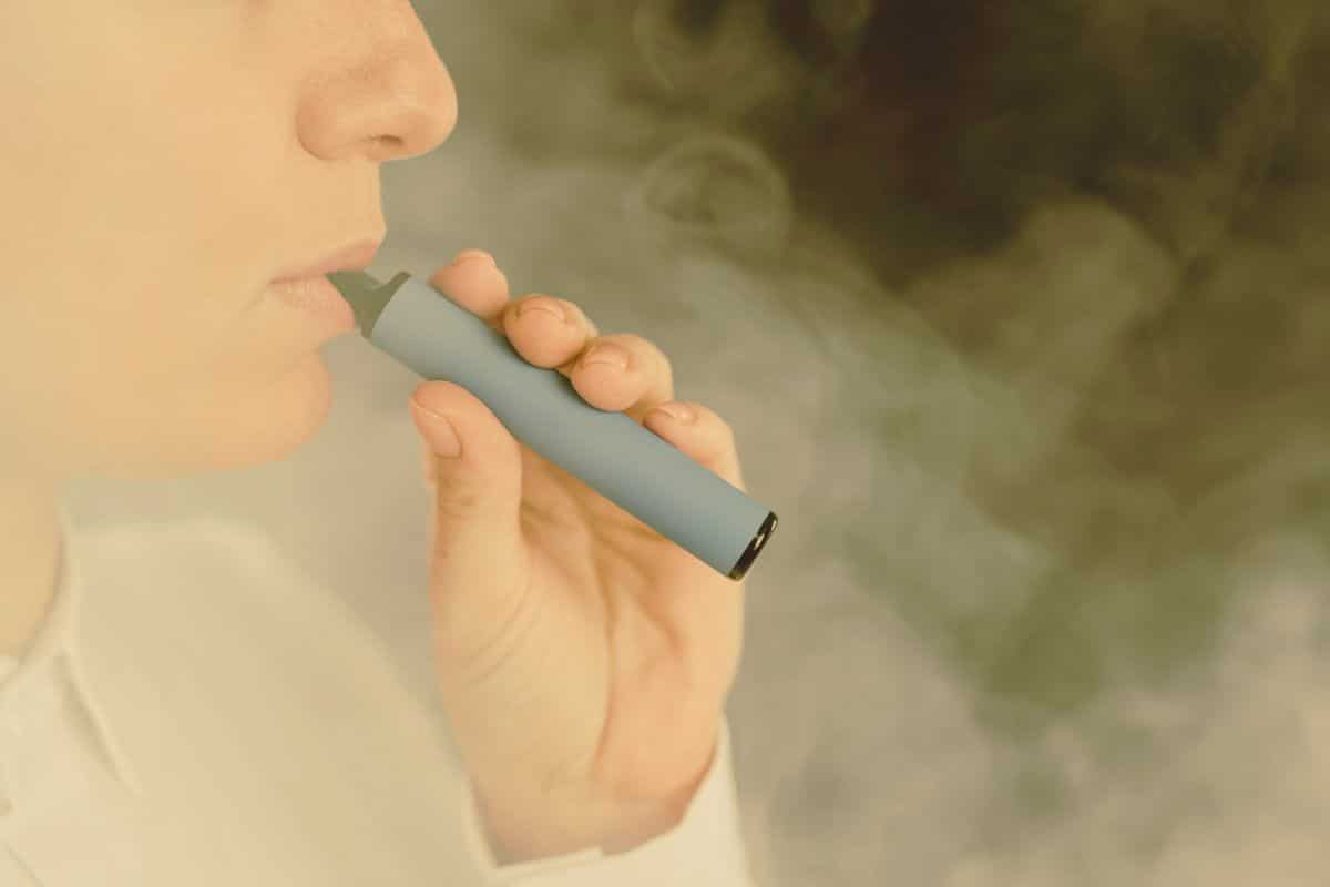 A man using long lasting Elf Bar disposable vape A man using long lasting Elf Bar disposable vape