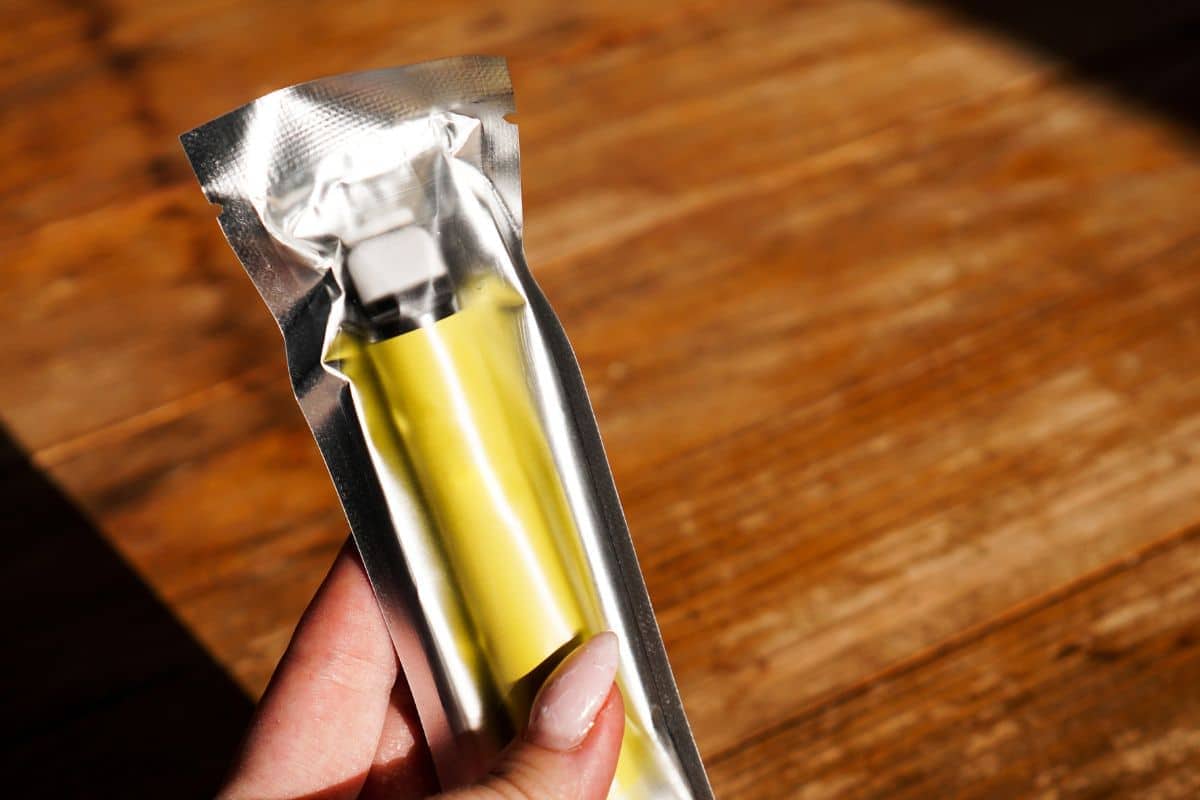 A woman holding brand new ELF bar in her hand A woman holding brand new ELF bar in her hand