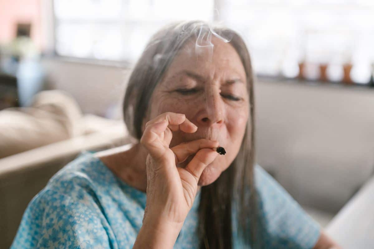 An old lady smoking weed to manage her pain.