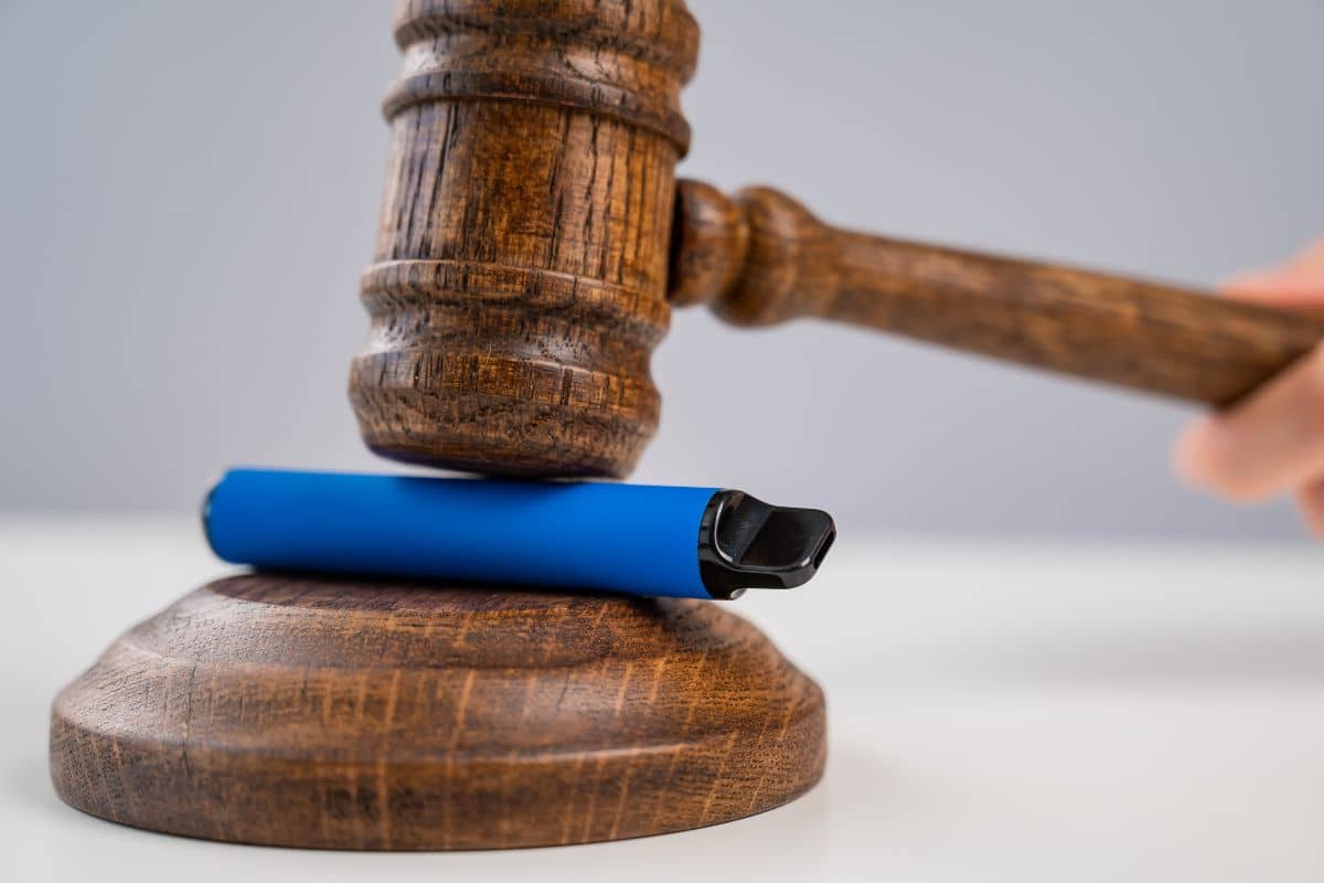 Laws about vape products featuring regulatory icons and a gavel.