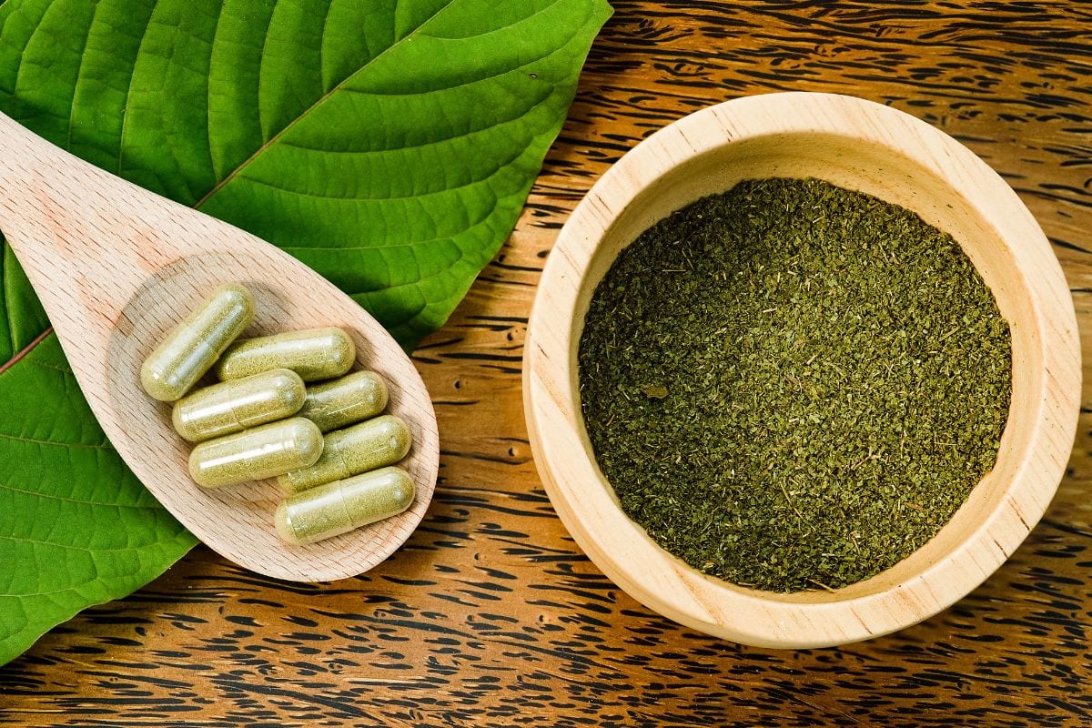 Kratom leaf, capsules and powder kept together for consumption directly