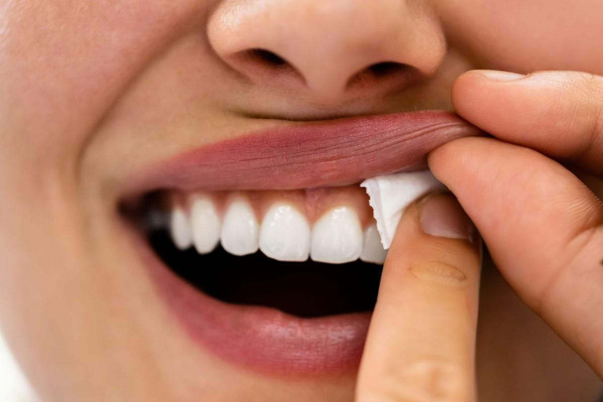 A lady consuming a zyn nicotine pouch