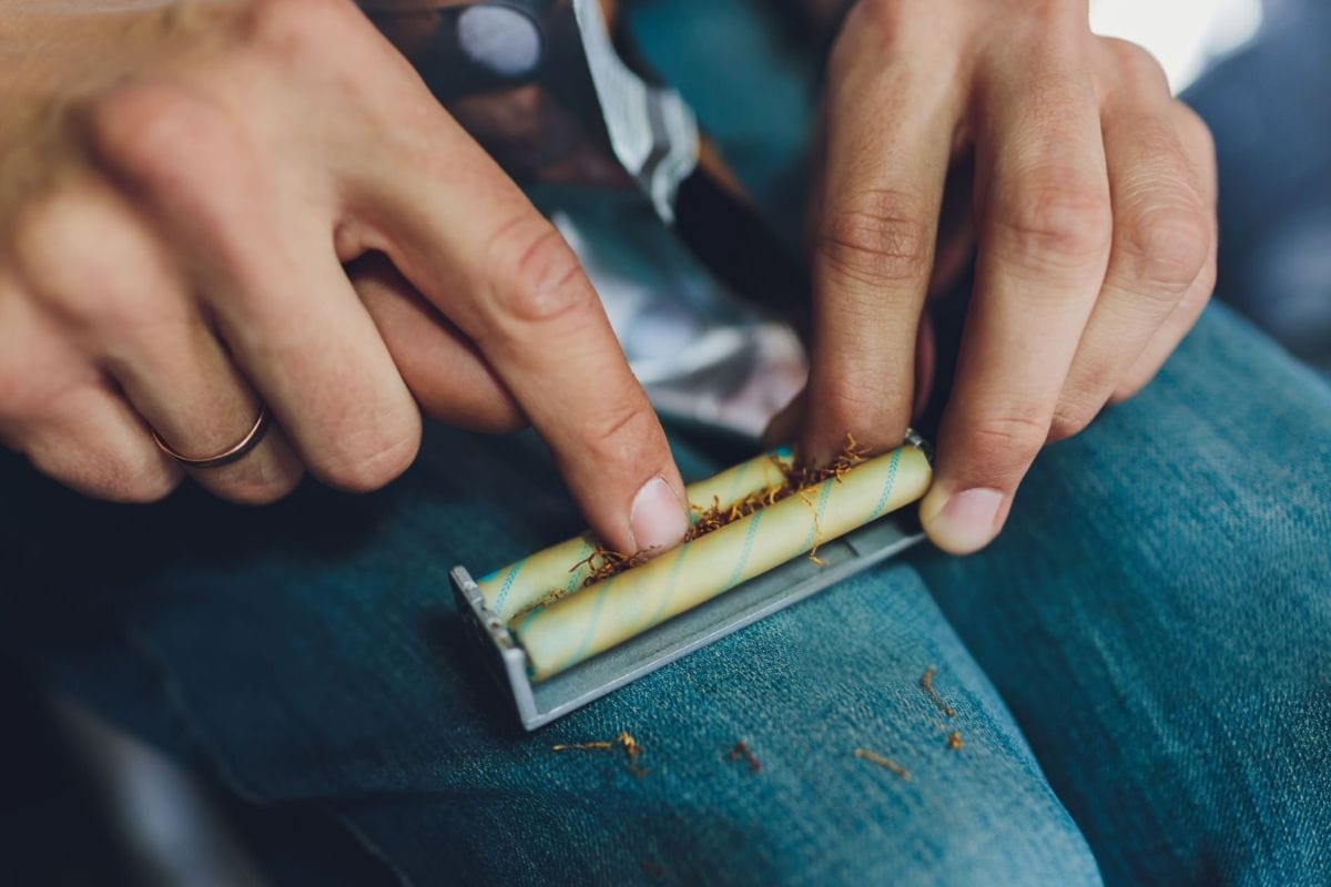 A person using blunt roller and preparing his joint