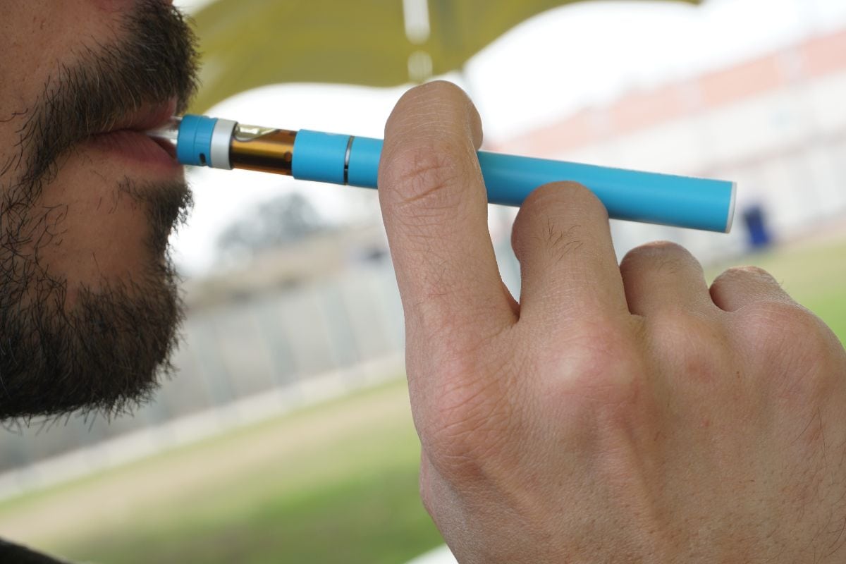 A person using a Penjamin vape for vaping